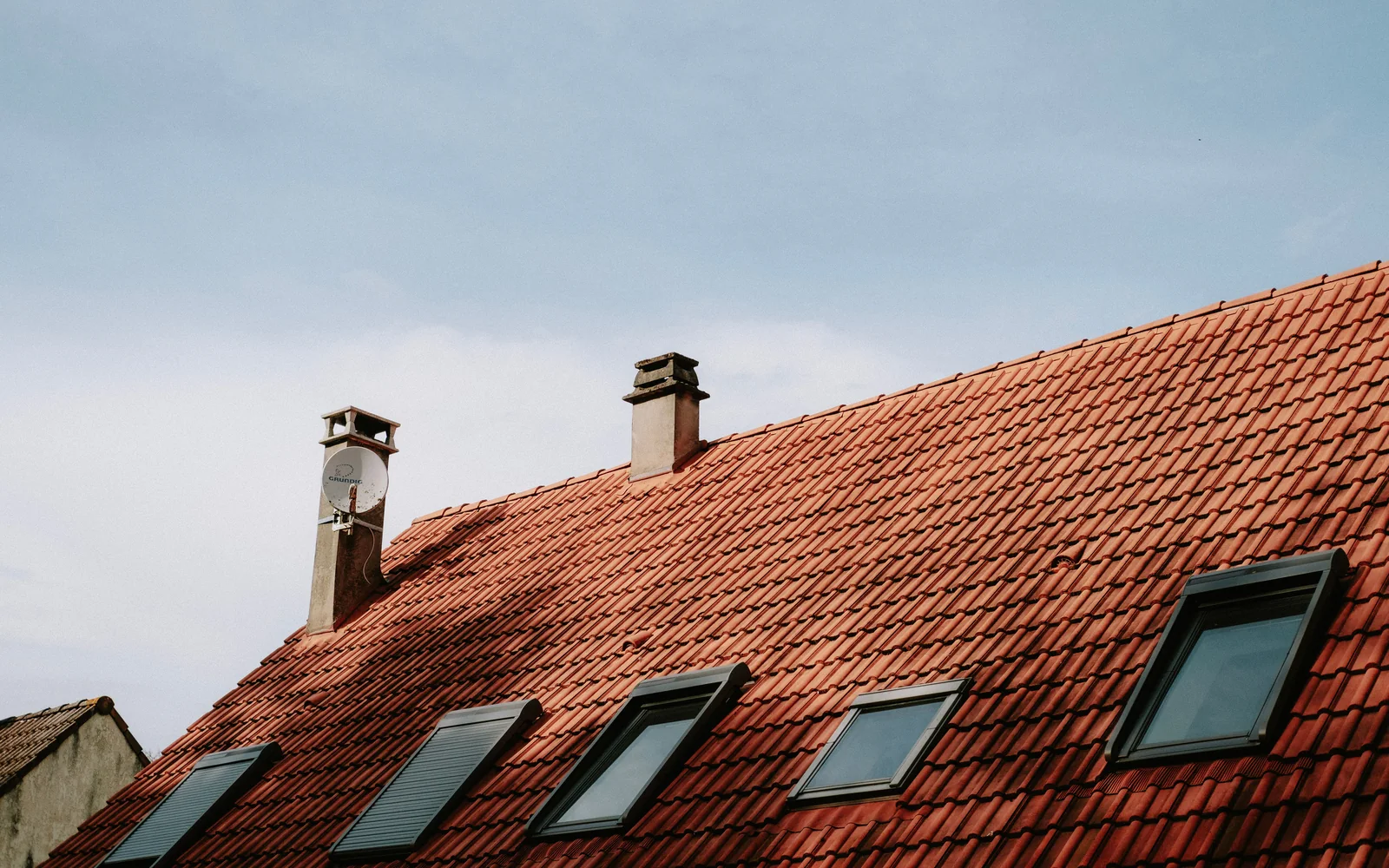 Roofing professional working on a roof