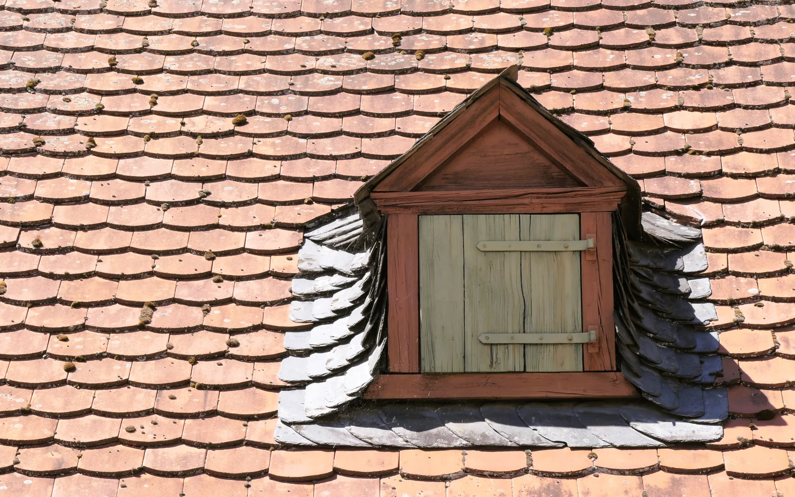 Roofing professional working on a roof